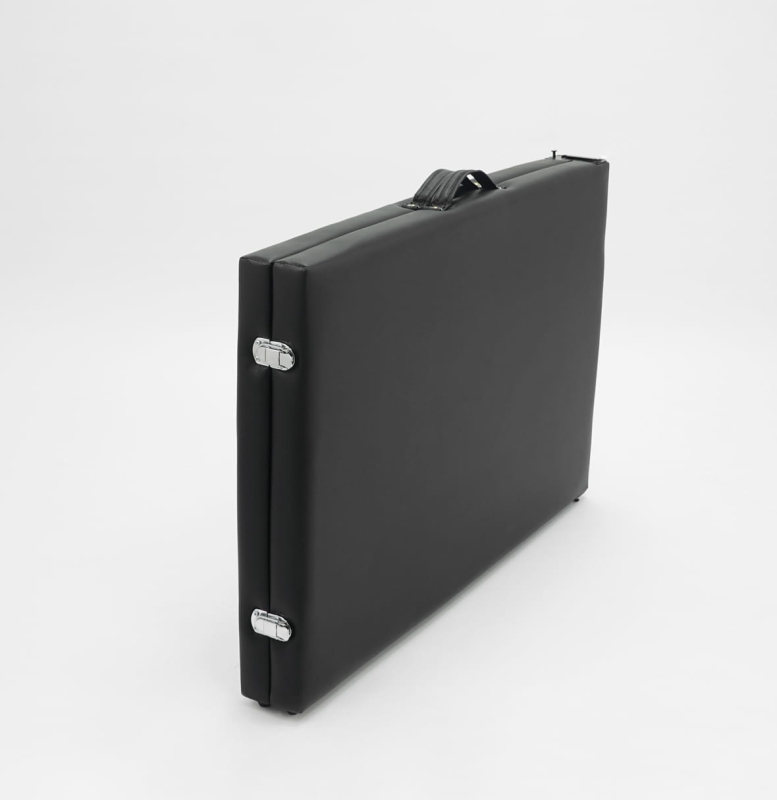 Czarne łóżko Space SLIM 70cm na tle białego gabinetu kosmetycznego